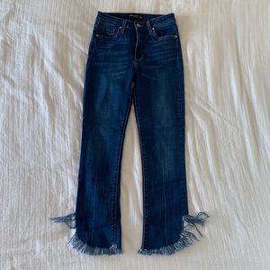 Blue jeans with frayed bottoms